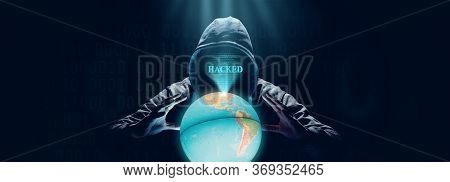 Anonymous Internet Hacker In Front Of Computer. Web Crime Concept