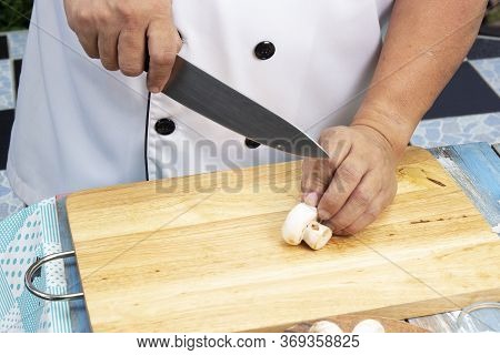 Chef Cut Mushrooms With A Knife  / Cooking Mushroom Cream Soup Concepti