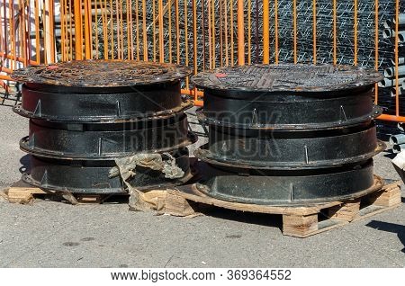 New Sewerage Hatchway Are Stacked On Top Of Each Other Before Installation. Road Works