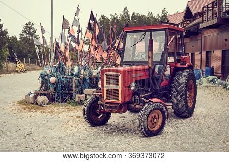 Debki, Poland - May 25, 2020:tractor For Pulling Fishing Boats In A Fishing Harbor. Debki, Poland