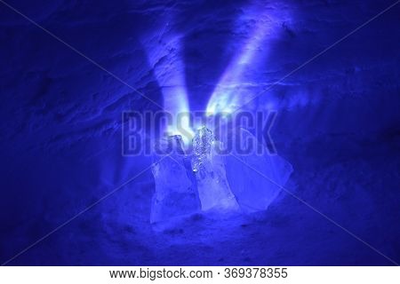 A Small Light Source Causes Exploding Purple Rays To Spread Out From Behind These Chunks Of Ice. Ref
