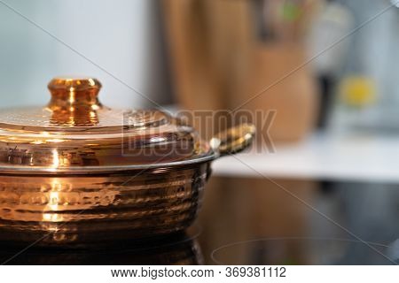 Vintage Textured Copper Cooking Pot On Kithcen Stove, Cooking Mixing Food In Pot