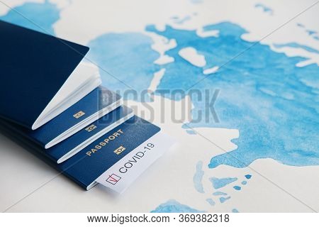 Immunity Passport, Risk-free Certificate Concept. Passports With Note Covid-19 Coronavirus With Red 