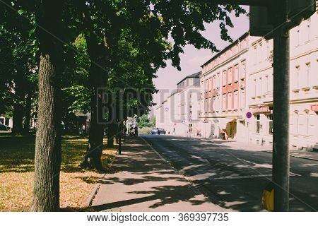Riesa/germany - July 23/2018: Photo Of Cityscape With Houses, Asphalt Road And Trees On A Sunny Day
