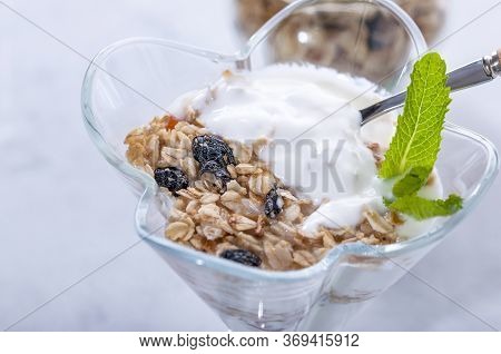 Homemade Granola With Raisins, Dried Apricots And Nuts.
Granola With Raisins, Dried Apricots, Nuts, 