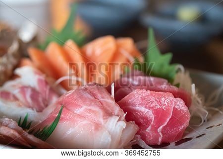 Selective Focus Of Mixed Slices Of Fresh Raw Salmon Sashimi For Dinner. Assorted Fresh Sashimi And J