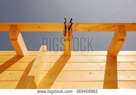 Exterior Roof Detail On A Partially Constructed Wood (fir) Block House, A Pre-cut Wooden House Which