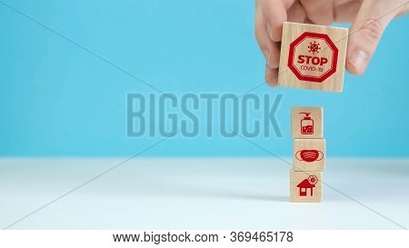 Manual Organization Wood Block Stacking With Health Icon Coronavirus. Insurance For Your Health Conc