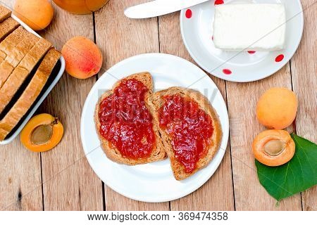 Homemade Delicious Apricot Jam, Appricot Marmalade And Butter On Table