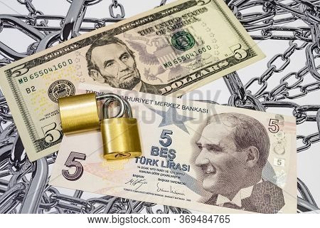 Close Up Us Dollar And Turkish Lira Banknotes With Padlocks On Chain Background