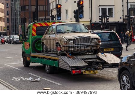 London, Uk: Dec 2, 2017: A Motor Car Transporter Is Seen In Central London, Carrying A 1979 Vanden P
