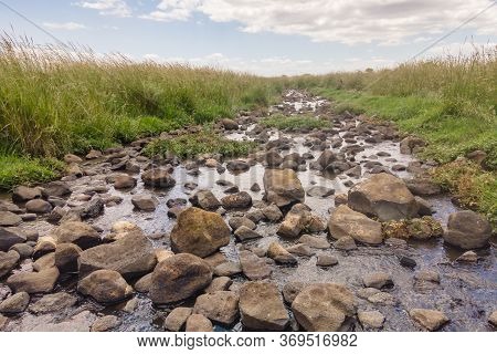 Shallow River Daliyot Flowing Near The Remnants Of The Early Bronze Age Megalithic Complex Of The Ea