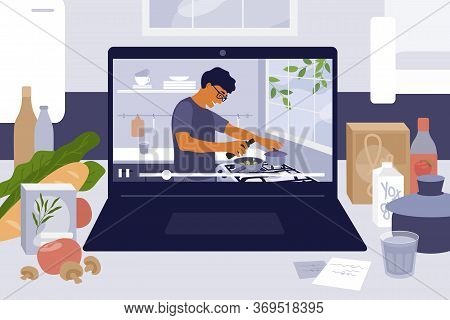 Laptop On Kitchen Table With Cooking Online Master Class. Culinary Video Blog, Show With Man Prepari