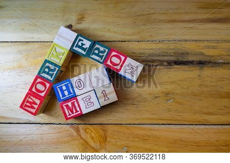 Conceptual Of Work From Home During Lockdown Directives During Virus Outbreak. Wooden Alphabet Cubes
