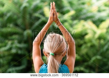 Blond Caucasian Girl In Namaste. Girl Hands In Namaste Gesture Outdoor Summer Day. Yoga, Mindfulness