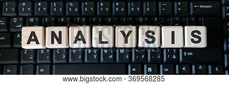 Analysis - Business Concept Text On Wooden Cubes On Background Black Keyboard
