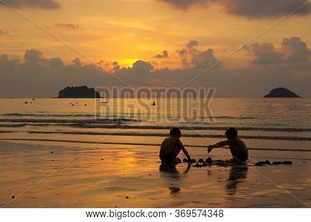 Koh Chang, Thailand - January, 2013: Children Playing In The Sunset