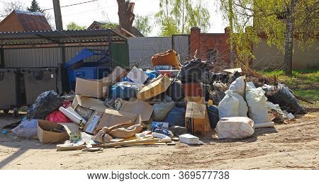 Zaraysk, Russia - 1 May, 2019: A Huge Pile Of Household Rubbish Piled Up Next To Empty Trash Cans. B
