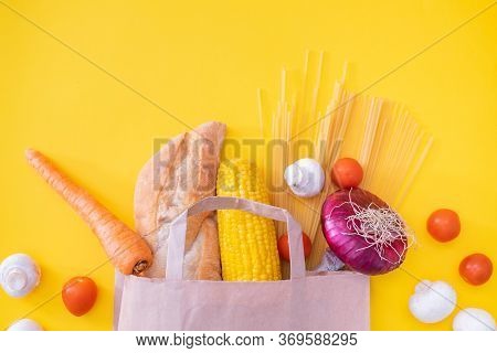 Grocery Food D.elivery At Home Flat Lay On Yellow Background. Paper Craft Bag With Grocery And Vario