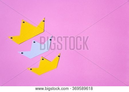 Three Paper Crowns On Pink Background With Copy Space. Minimal Thing. Concept Of Mother's Day, Mothe