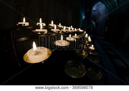 5 Rows Of Prayer Candles Run From Left To Right In This Wide Angle Photo From A Cathedral