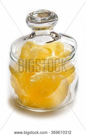 Dried Pineapple Candy Rings, In Powdered Sugar, Close-up Under Sunlight, Lying In A Transparent Glas