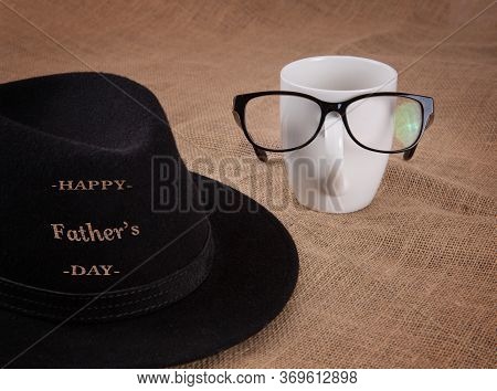 Happy Fathers Day Concept. Design With Hat And Glasses On A Glass.