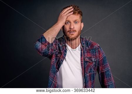 Indoor Shot Of Shocked And Stunned Male With Red Hair And Bristle, Punching Himself At Forehead And 