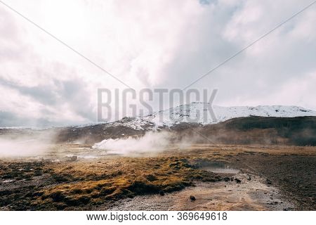 Geyser Valley In The Southwest Of Iceland. The Famous Tourist Attraction Geysir. Geothermal Zone Hau