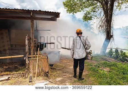Man Fogging Mosquito Spraying Machine To Prevent Of Dengue Fever For Protection People
