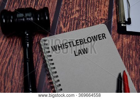 Book About Whistleblower Law Isolated On Wooden Table.