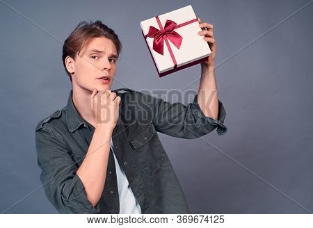 Portrait Of A Pensive Handsome, Charming, Young Caucasian Man, In A White T-shirt And Hacky Shirt, S