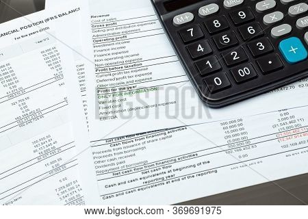 Close-up Calculator On Financial Report - Business Accounting Concept