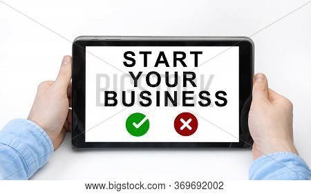 Male Hands Holding Tablet Pc With Start Your Business On White Background