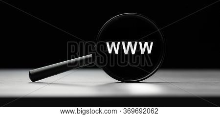 Magnifying Glass With Text Www On Wooden Table. Concept Of Search