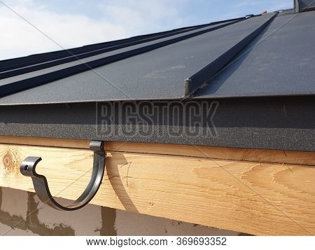 Close Up View Of Folded Roof Of House Under Construction With Holders For Gutters Water Drainage Sys