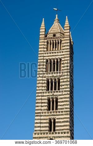 Closeup Of The Ancient Bell Tower Of The Siena Cathedral (duomo Di Siena, Santa Maria Assunta,1220-1