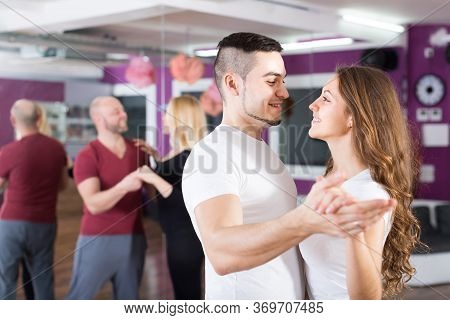Two Happy Smiling Loving Couples Having Dancing Class In Club
