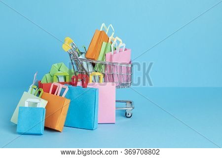 Shopping Basket Full Of Paper Bags. Sesonal Sale, Online Deals, Discounts, Promotion, Shopping Addic
