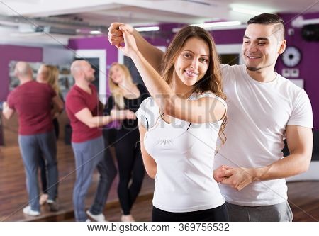 Happy Adult Couples Enjoying Of Partner Dance Indoor