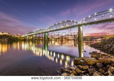 Chattanooga, Tennessee, USA river and bridge at dusk.