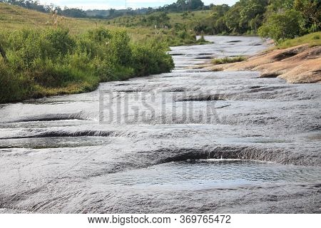 Rio Las Gachas With Its Peculiarity Of Passing Over This Great Rock And Drilling Huge Holes Through 
