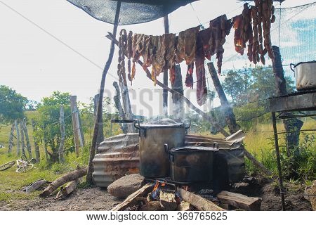 Meat Exposed To The Sun To Carry Out A Traditional Cooking Process In The Colombian Countryside, Las