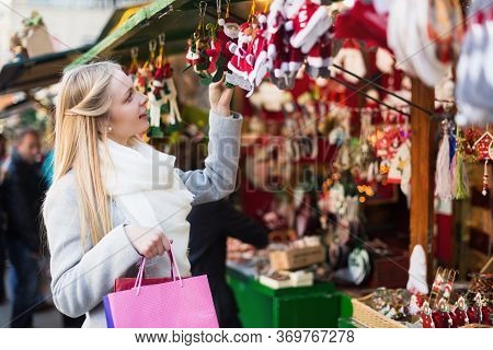 Happy Beauty Blonde Female Shopping At Festive Fair Before Xmas