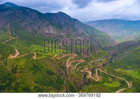 Top View Of A Winding Dirt Road Near The Canyon Of The Vorotan River Near Tatev Monastery, A Tourist