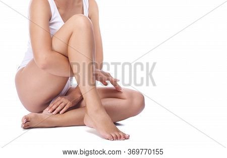 The Legs Of A Young Girl, Part Of The Female Body, Tanned Skin, Body Care, Female Legs Isolated On W