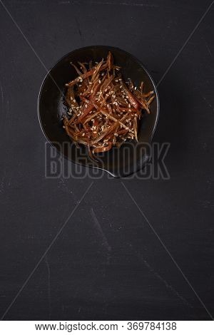 Traditional Japanese Salad Kinpira Gobo. Fried Burdock Root And Carrot With Sesame Seeds. Top View