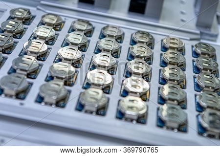 Battery Pack Cnc Machine. Many Flat Round Batteries Are Mounted On The Circuit Board.