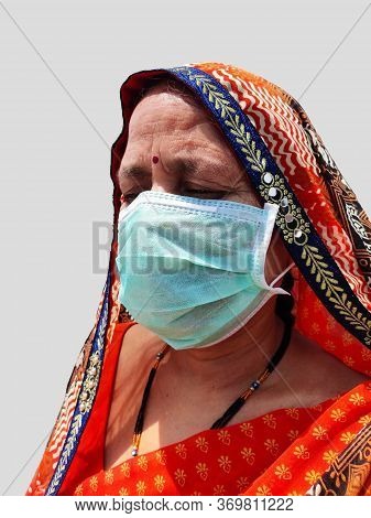 Indian Woman In Saari Wearing Face Mask For Corona Virus Protection.