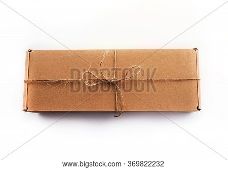 The Brun Squared Present Box On A White Background With Jute Rope